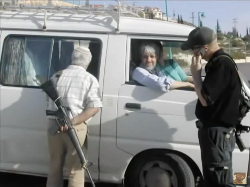 Zionist-settlers-looking-into-bus